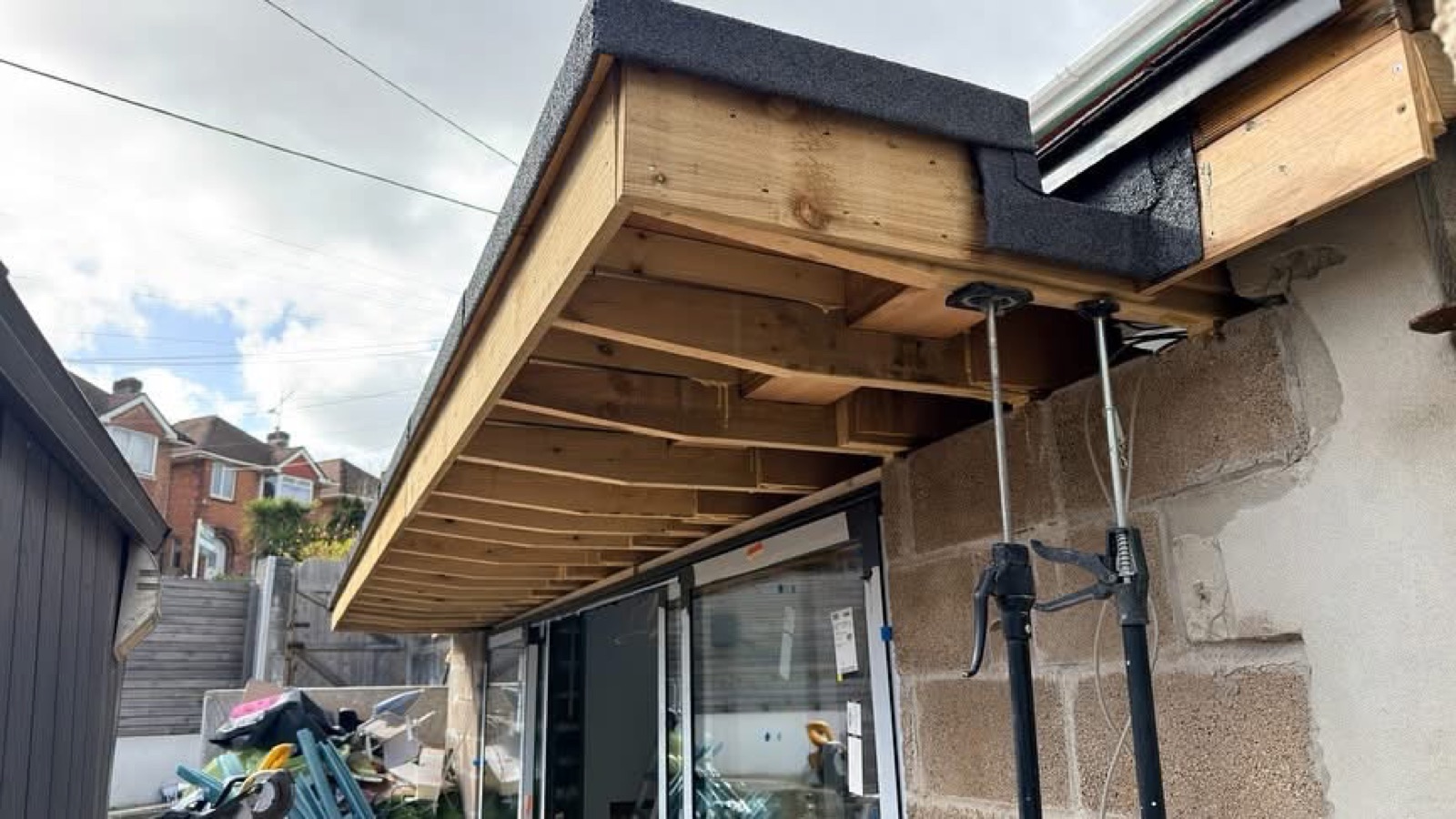 Exposed timber framing before the soffit finish